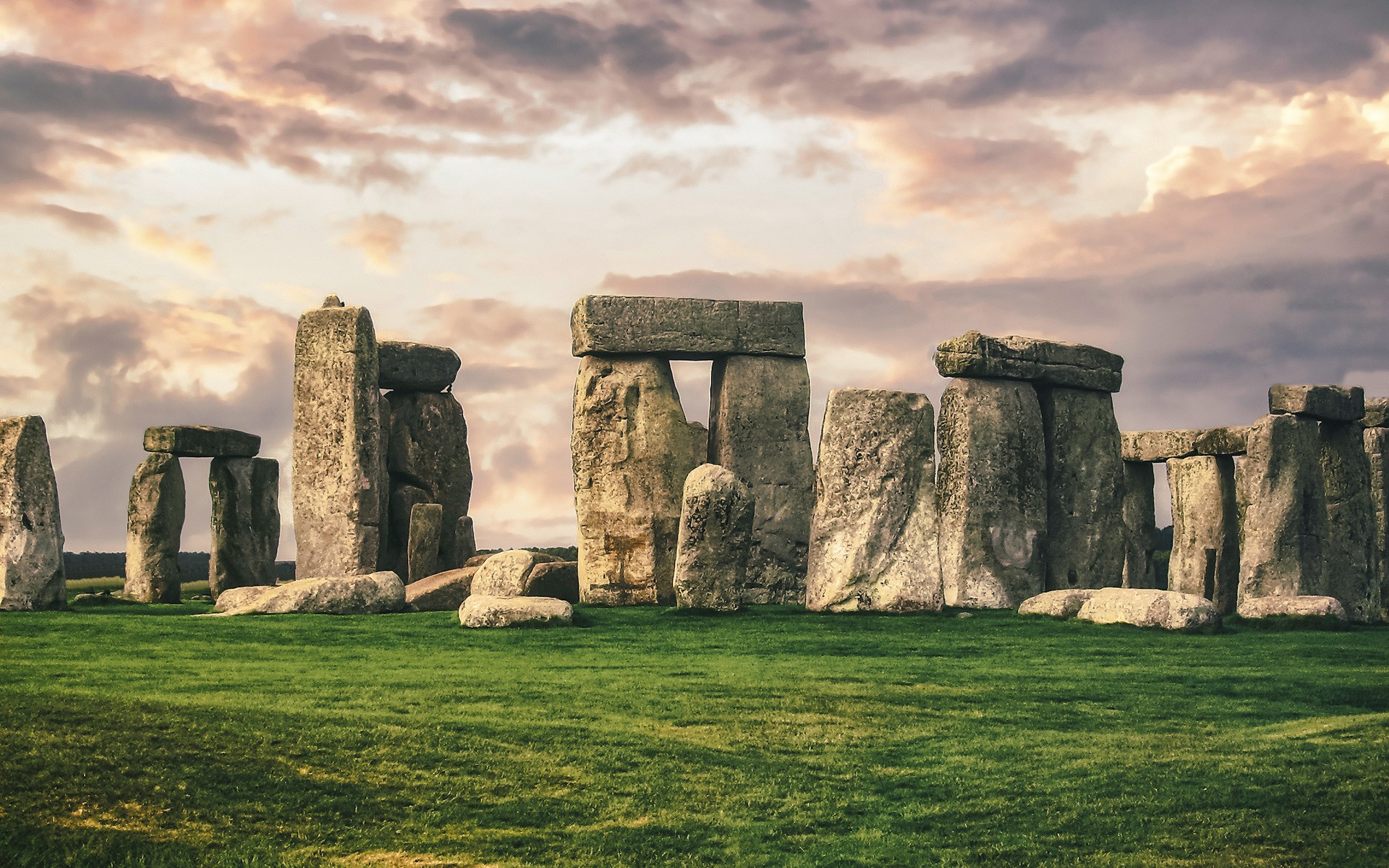 Mystical Stonehenge monument, a UNESCO World Heritage Site, featuring ancient stone pillars in a dramatic landscape in Wiltshire, England.