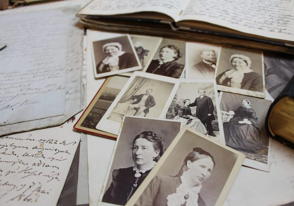 Old family photos laid out on a table